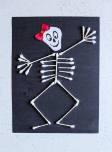 Skeleton craft made from q-tips and black cardstock.
