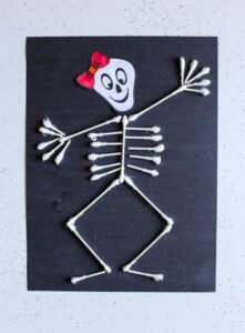 q-tip-skeleton Skeleton craft made from q-tips and black cardstock.