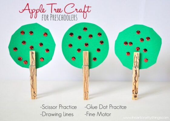 Make an apple tree from paper, sequins, and a clothespin or cardboard tube for the trunk.