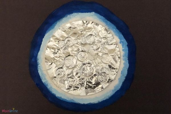 Aluminum Foil Moon Moon craft made with aluminum foil and paper.