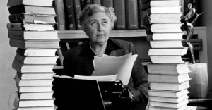Novelist Agatha Christie, surrounded by books.
