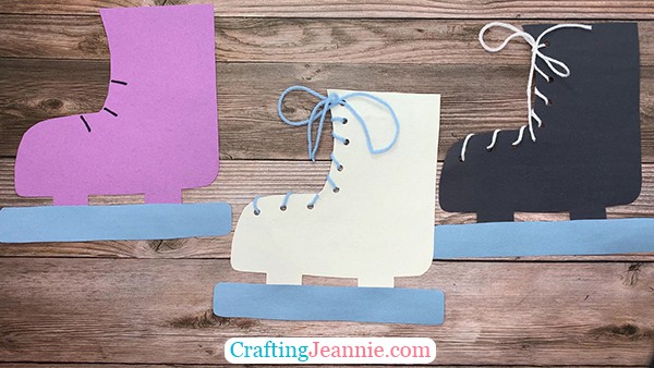 Make an ice skate out of paper and lace it up with yarn.